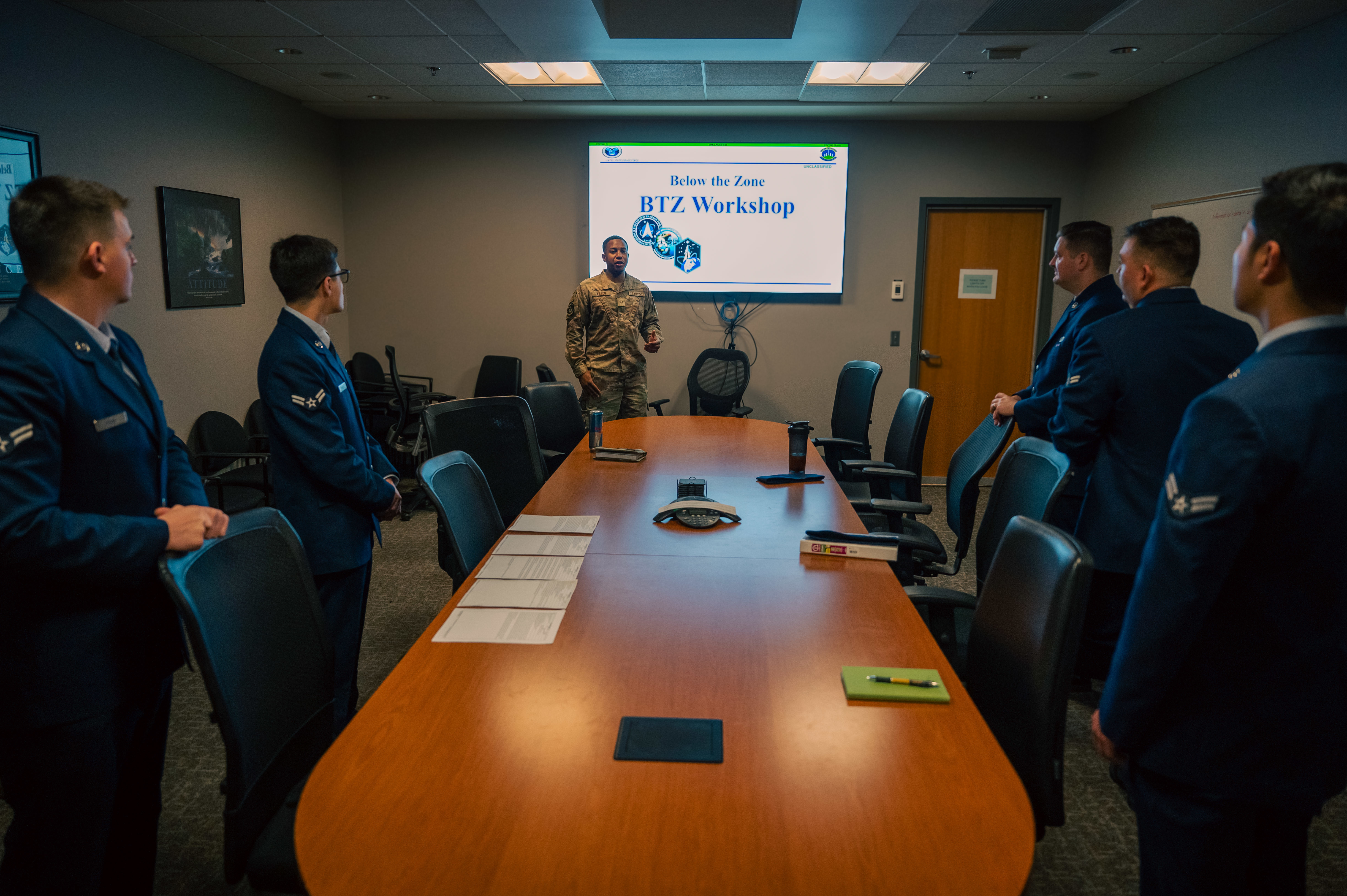 U.S. Air Force Senior Airman Quinton Wilson, president of the Rising 4, briefs at a Below the Zone mock board at Buckley Space Force Base, Colo., May 12, 2025. Wilson mentors junior Airmen through professional development events designed to build confidence and career readiness. (U.S. Space Force photo by Senior Airman Joshua Hollis)