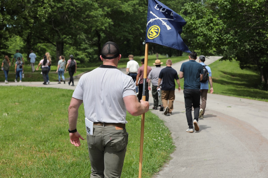 Officer Candidate Parker Meads carries the company guidon as Illinois Army National Guard Officer Candidate School students conduct a staff ride at Fort Donelson National Battlefield, Tennessee, May 17, 2025.