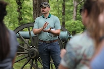 Officer Candidate John Winkler applauds fellow officer candidates during a stop at Fort Donelson National Battlefield as part of the Illinois Army National Guard OCS staff ride, which connects historical military leadership with modern officer development.