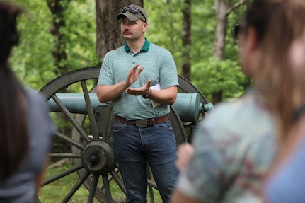 Officer Candidate John Winkler applauds fellow officer candidates during a stop at Fort Donelson National Battlefield as part of the Illinois Army National Guard OCS staff ride, which connects historical military leadership with modern officer development.