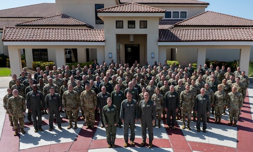 Total Force leaders pose for a group photo during Phoenix Rally at MacDill Air Force Base, Florida, May 15, 2025. Phoenix Rally focused on Air Mobility Command's priorities and how to work together to ensure rapid global mobility across the joint force. (U.S. Air Force photo by Airman 1st Class Monique Stober)