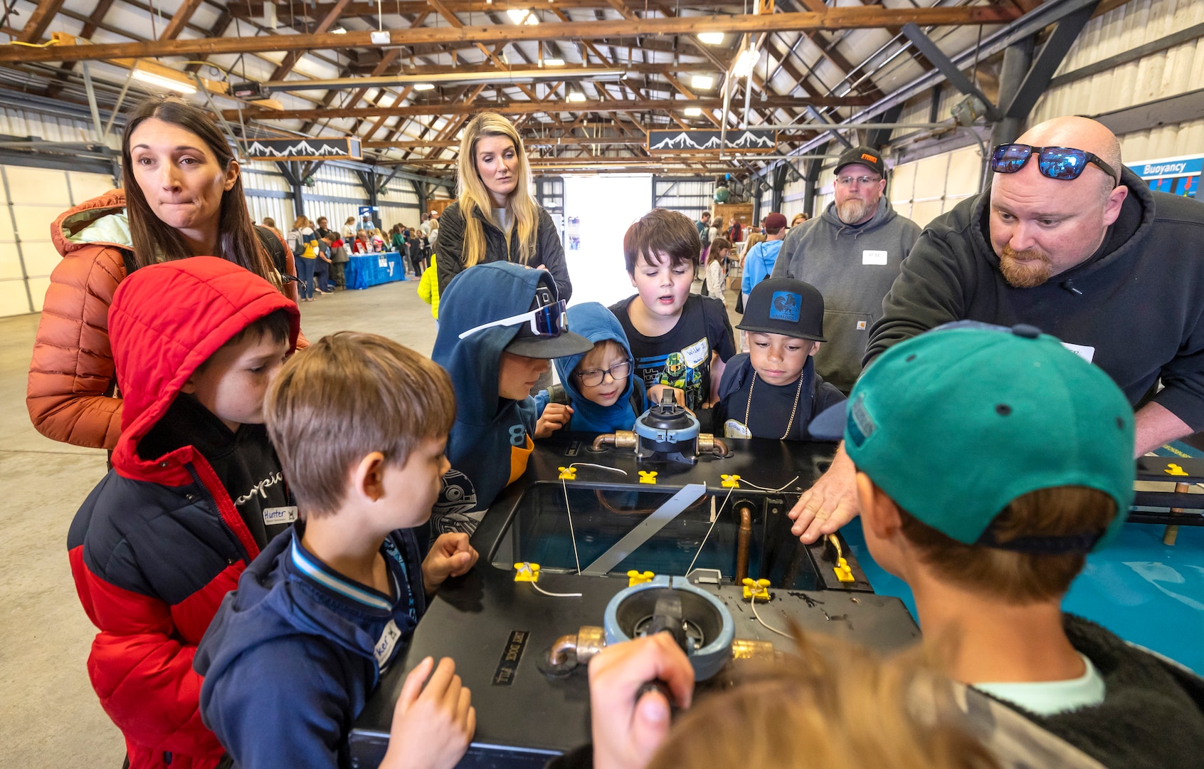 Theron Bergland, general foreman, Shop 64, Shipwrights, demonstrates how dry docks work May 14, 2025, during the 2025 Kitsap Water Festival at the Kitsap County Fairgrounds in Bremerton, Washington. (U.S. Navy photo by Wendy Hallmark)