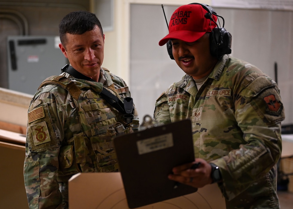 U.S. Air Force Staff Sgt. Edgardo Gutierrez, 17th Security Forces Squadron Combat Arms Training and Maintenance instructor, reads Staff Sgt. Humberto Gomez Jacquez, Shooting Competition participant, his Shooting Competition score at Goodfellow Air Force Base, Texas, May 13, 2025. Participants attempted to have the highest qualification on both the M4 and M18 weapon systems. (U.S. Air Force photo by Senior Airman Evelyn J. D’errico)