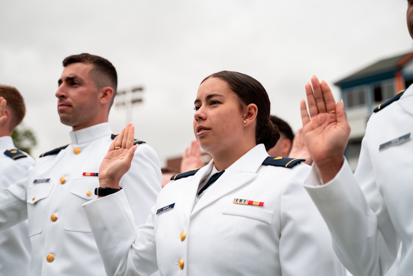 1st Class Cadet Avis Do Akers takes the oath of office during the 144th Commencement Exercises at the Coast Guard Academy, New London, Connecticut, May 21, 2025. The oath off office is taken by all officers prior to receiving their commission. (U.S. Coast Guard photo by Petty Officer 3rd Class Matt Thieme.)