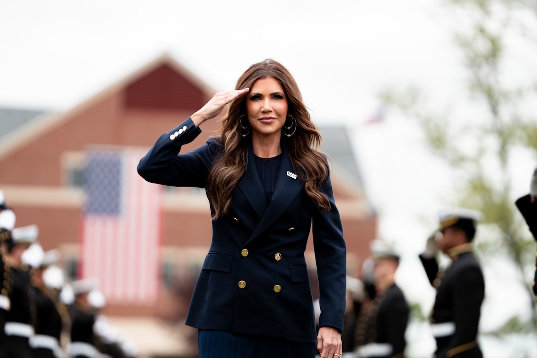Department of Homeland Security (DHS) Secretary Kristi Noem marches onto Cadet Memorial Field during the 144th Commencement Exercises at the U.S. Coast Guard Academy, May 21, 2025. Noem shared the details of Force Design 2028 which includes plans to purchase new aircraft, grow the workforce by 15,000 people, fix agin facilities and begin a once-in-a-generation transformation of the 234-year old maritime service. (U.S. Coast Guard photo by Petty Officer 3rd Class Matt Thieme.)