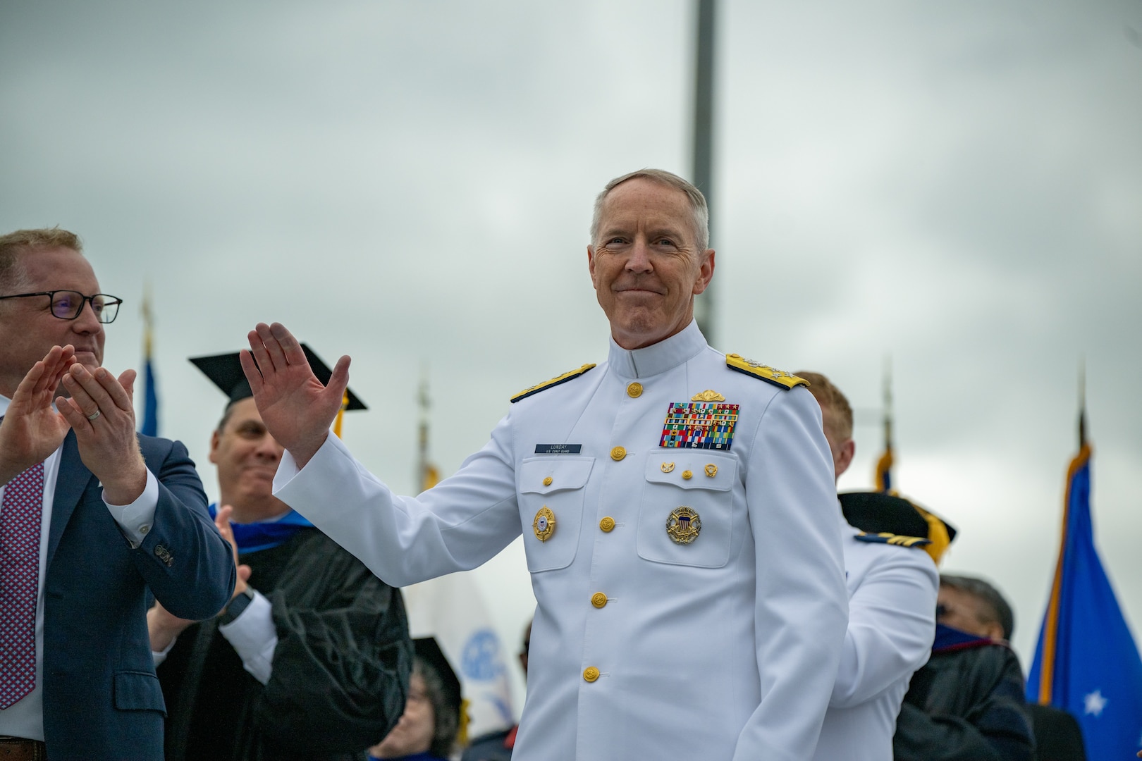 U.S. Coast Guard Commandant Adm. Kevin Lunday waves during the 144th Commencement Exercises at the U.S. Coast Guard Academy (USCGA), New London, Connecticut, May 21, 2025. Lunday was officially nominated as the 28th Commandant of the U.S. Coast Guard. (U.S. Coast Guard photo by Petty Officer Third Class Leo Avila.)