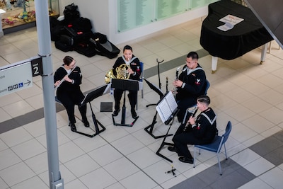 WELLINGTON, New Zealand (May 19, 2025) Sailors assigned to the U.S. 7th Fleet Band embarked aboard the U.S. 7th Fleet flagship, USS Blue Ridge (LCC 19), perform at the local Wellington Hospital during a scheduled port visit in Wellington, New Zealand, May 20, 2025. U.S. 7th Fleet is the U.S. Navy's largest forward-deployed numbered fleet, and routinely interacts and operates with allies and partners in preserving a free and open Indo-Pacific region. (U.S. Navy Photo by Musician 3rd Class Christiena Taralson)