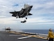 Two F-35B Lightning II fighter aircrafts from Marine Fighter Attack Squadron (VMFA) 242, prepare to land on the flight deck the forward-deployed amphibious assault ship USS America (LHA 6) while conducting flight operations in the East China Sea, May 20.