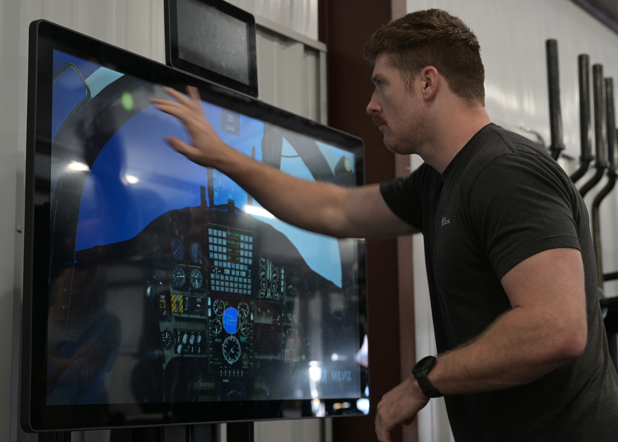 A CRAFT specialist demonstrates a touch screen-based cognitive agility training program