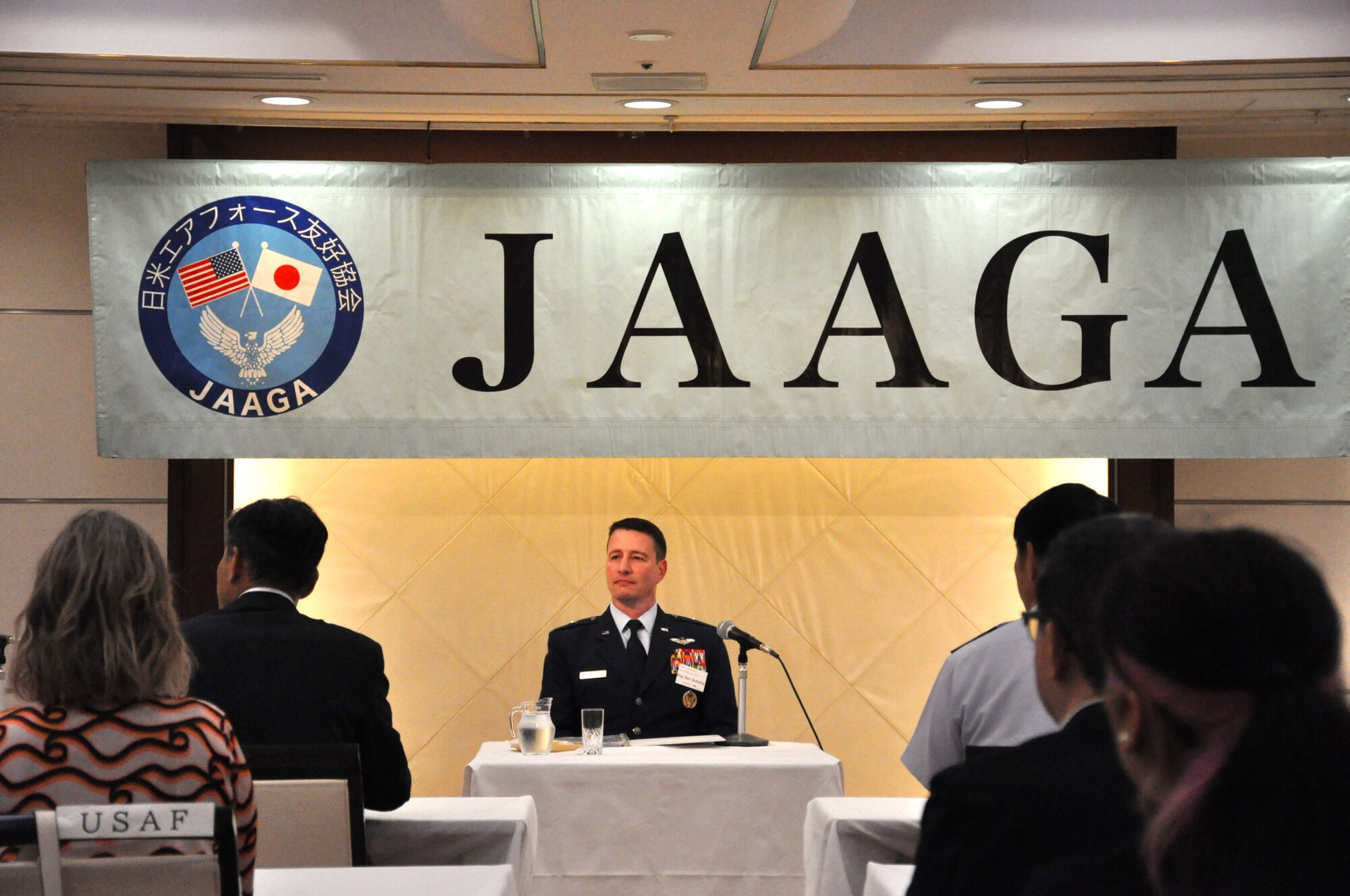 U.S. Air Force Brigadier General John Schutte, Fifth Air Force Deputy Commander, gives the keynote speech at the Japan America Goodwill Association Annual Convention at Grand Hill Ichigaya, Japan, May 13, 2025. The JAAGA convention provides an opportunity for senior military leaders to reflect on the successes their organizations have accomplished separately and collaboratively over the year.  (U.S. Air Force photo by Captain Tisha Yates)