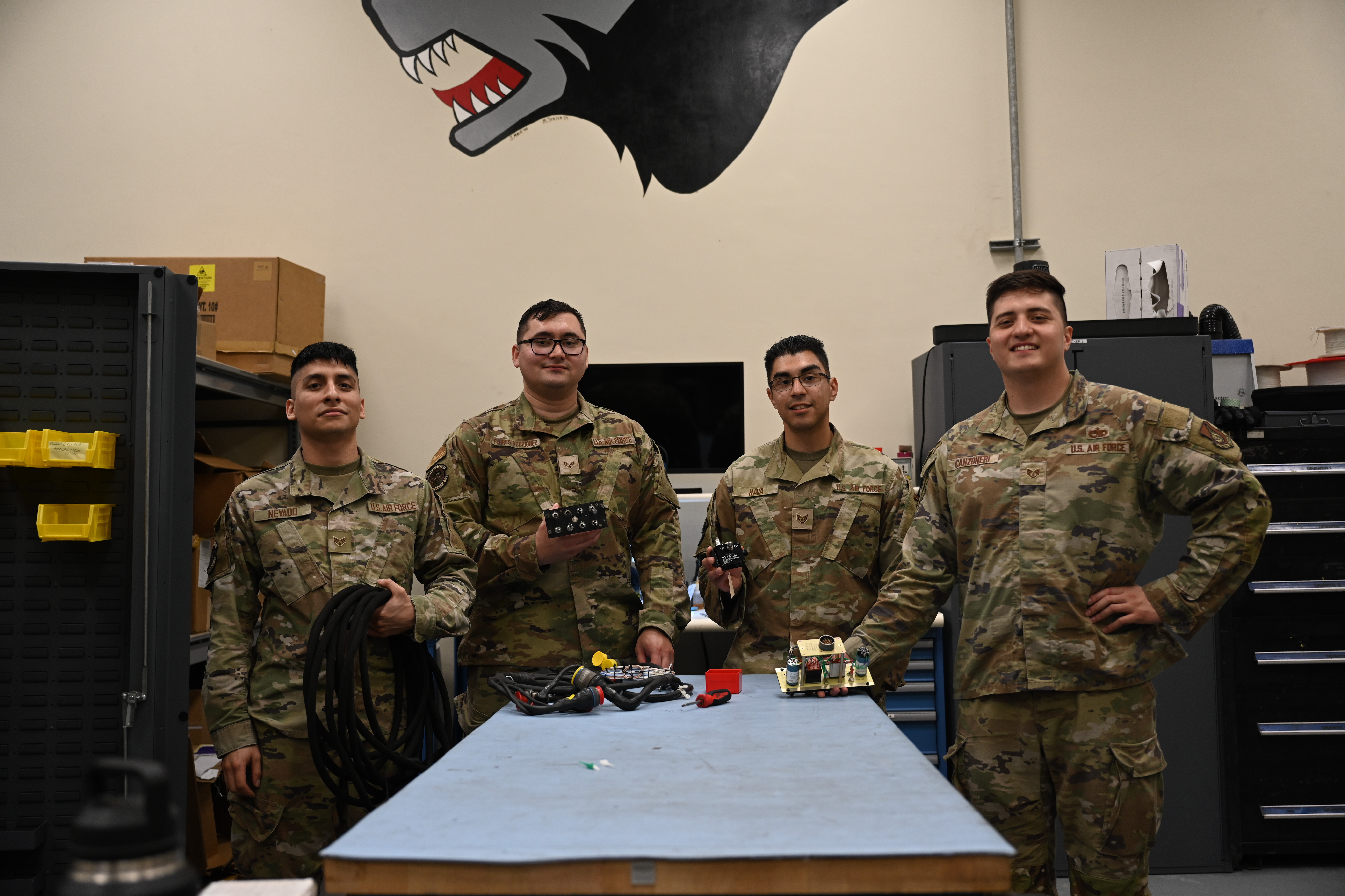 From left to right: U.S. Air Force Senior Airman Ernesto Nevado, 8th Maintenance Squadron AFREP technician, Senior Airmen Michael Philip Flores Rodriguez, 8th Maintenance Squadron AFREP technician, Staff Sgt. Edgar Nava, 8th Maintenance Squadron AFREP technician and Staff Sgt. Anthony Canzoneri, 8th Maintenance Squadron AFREP non-commissioned officer in charge, pose for a photo at Kunsan Air Base, Republic of Korea, May 21, 2025. The strategic approach of the AFREP program allows maintainers to repair rather than replace equipment, a valuable resource that extends beyond the maintenance group and keeps essential components readily available without relying on external repair locations. (U.S. Air Force photo biy Tech. Sgt. Giovanni Sims)