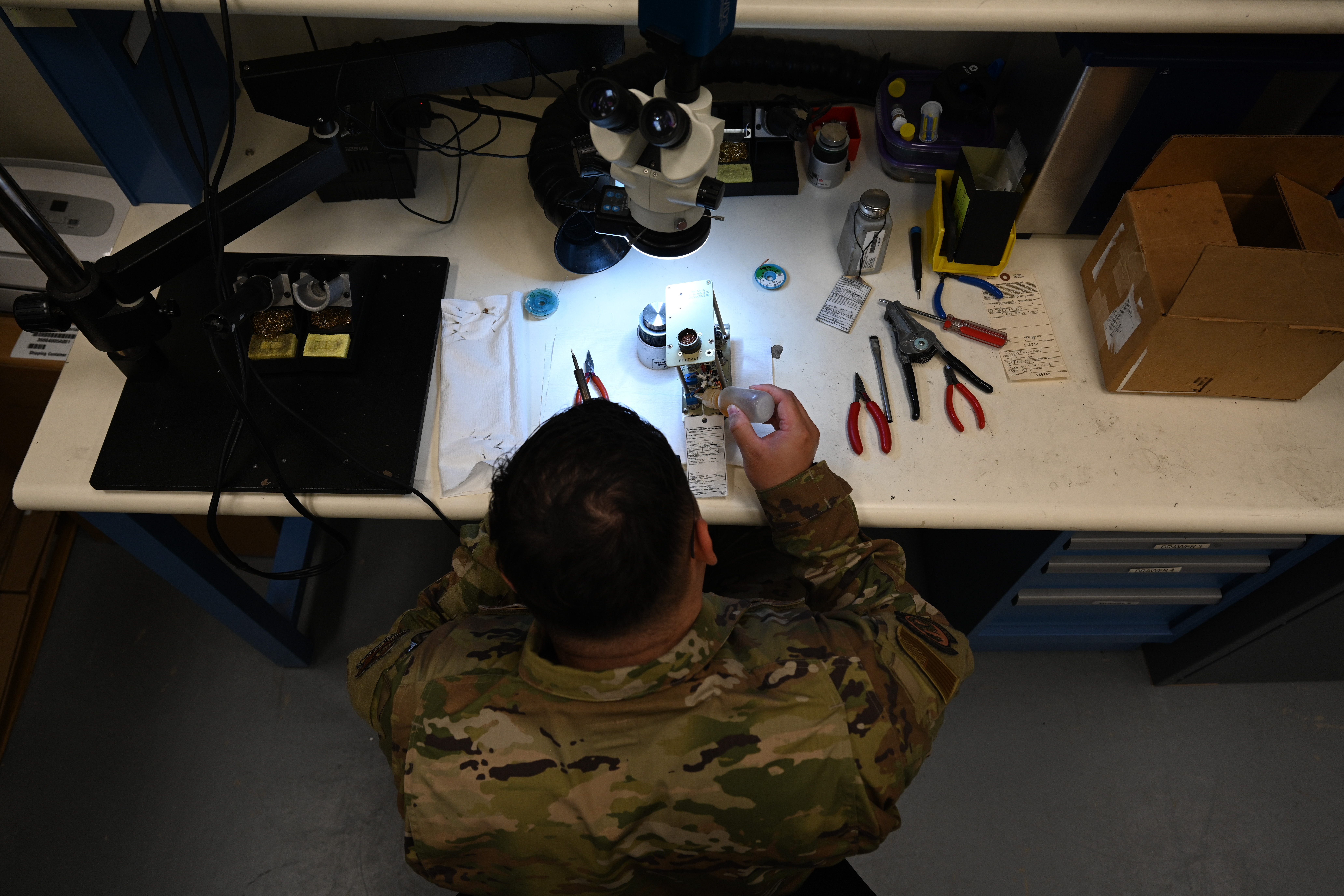 Senior Airman Michael Philip Flores-Rodriguez, 8th Maintenance Squadron AFREP technician, cleans a fault function panel with alcohol at Kunsan Air Base, Republic of Korea, May 25, 2025. The strategic approach within the AFREP program allows for maintainers to repair rather than replace equipment, a valuable resource that keeps essential components readily available without relying on external repair locations. (U.S. Air Force photo by Tech. Sgt. Giovanni Sims)