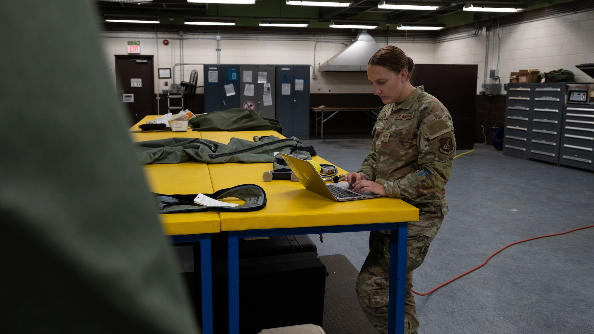 U.S. Air Force Senior Airman Meadow Brown, 51st Operations Support Squadron aircrew flight equipment technician, reviews technical orders at Osan Air Base, Republic of Korea, May 22, 2025. Aircrew Flight Equipment technicians inspect, maintain, fit, and fabricate life-support gear for pilots and aircrew, ensuring equipment is safe and mission-ready at all times to support the 51st Fighter Wing’s rapid response mission. (U.S. Air Force photo by Senior Airman Rome Bowermaster)
