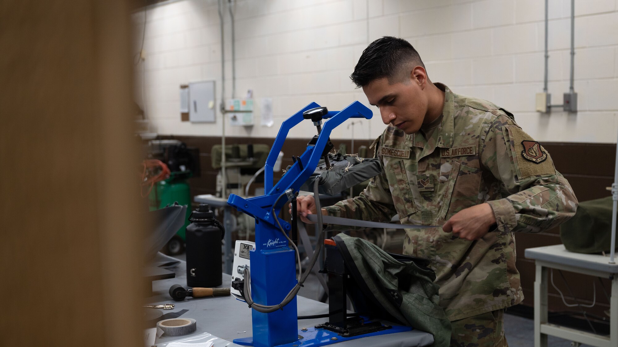 U.S. Air Force Senior Airman Keven Gomescoello, 51st Operations Support Squadron aircrew flight equipment technician, applies seam tape to an anti-exposure suit at Osan Air Base, Republic of Korea, May 22, 2025. Suit maintenance ensures pilots remain protected during over-water operations, which are common in the Indo-Pacific region. (U.S. Air Force photo by Senior Airman Rome Bowermaster)