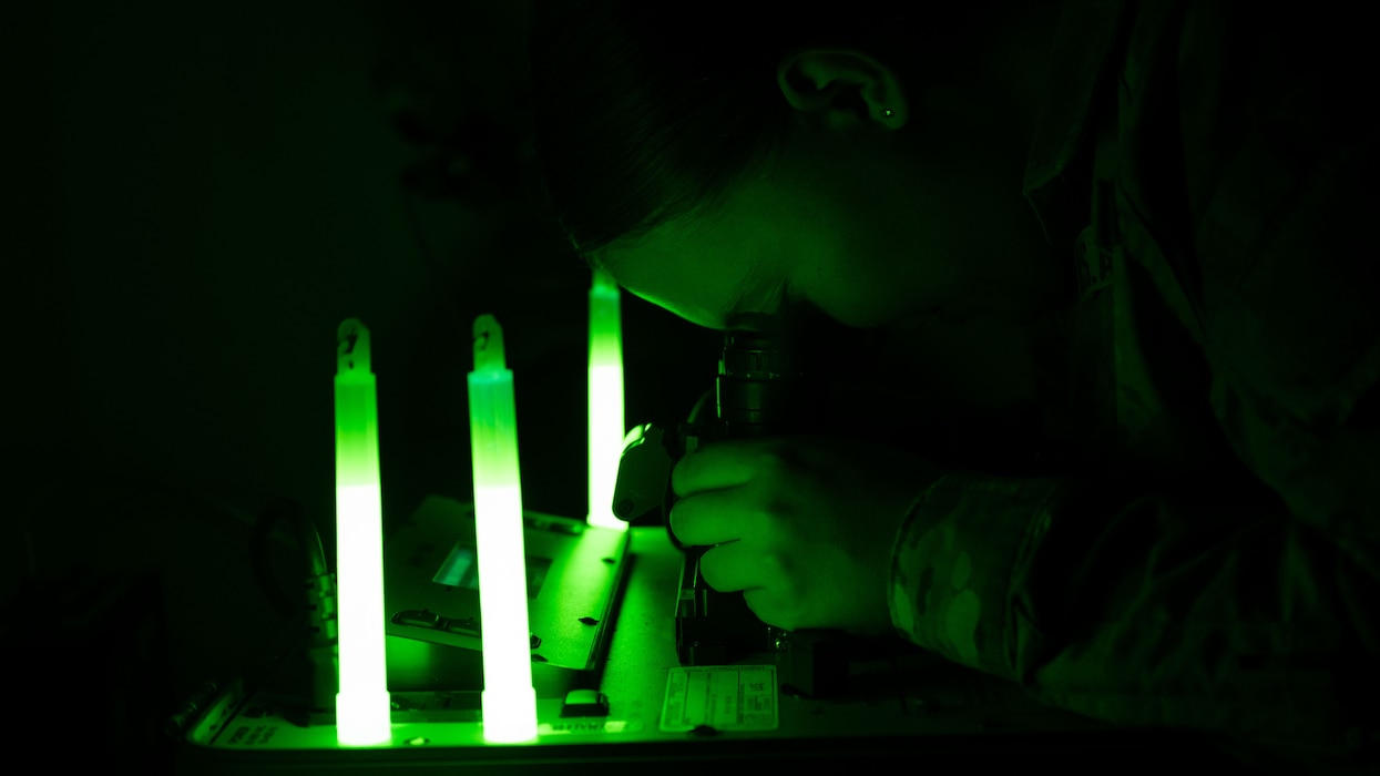 U.S. Air Force Senior Airman Meadow Brown, 51st Operations Support Squadron aircrew flight equipment technician, inspects night vision goggles at Osan Air Base, Republic of Korea, May 22, 2025. NVGs are checked every 180 days to ensure functionality for low-light missions and emergency scenarios such as ejection or recovery in unfamiliar terrain. (U.S. Air Force photo by Senior Airman Rome Bowermaster)