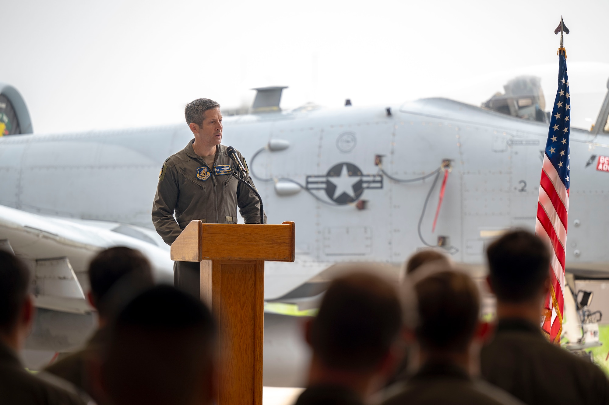U.S. Air Force Col. William McKibban, 51st Fighter Wing commander, delivers remarks while officiating the 51st Operations Group change of command ceremony at Osan Air Base, Republic of Korea, May 22, 2025.