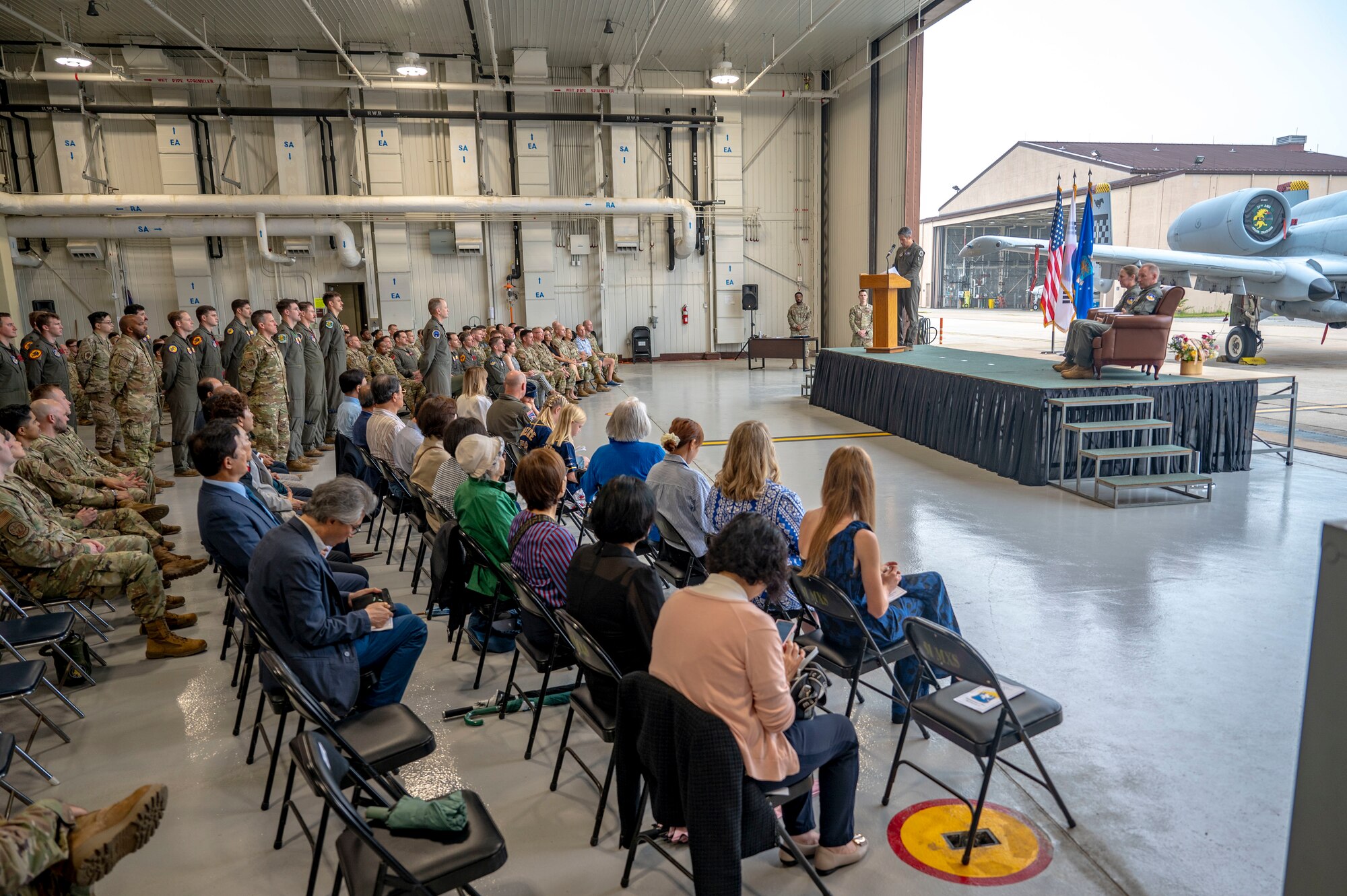 Airmen and guests observe the 51st Operations Group change of command ceremony at Osan Air Base, Republic of Korea, May 22, 2025.