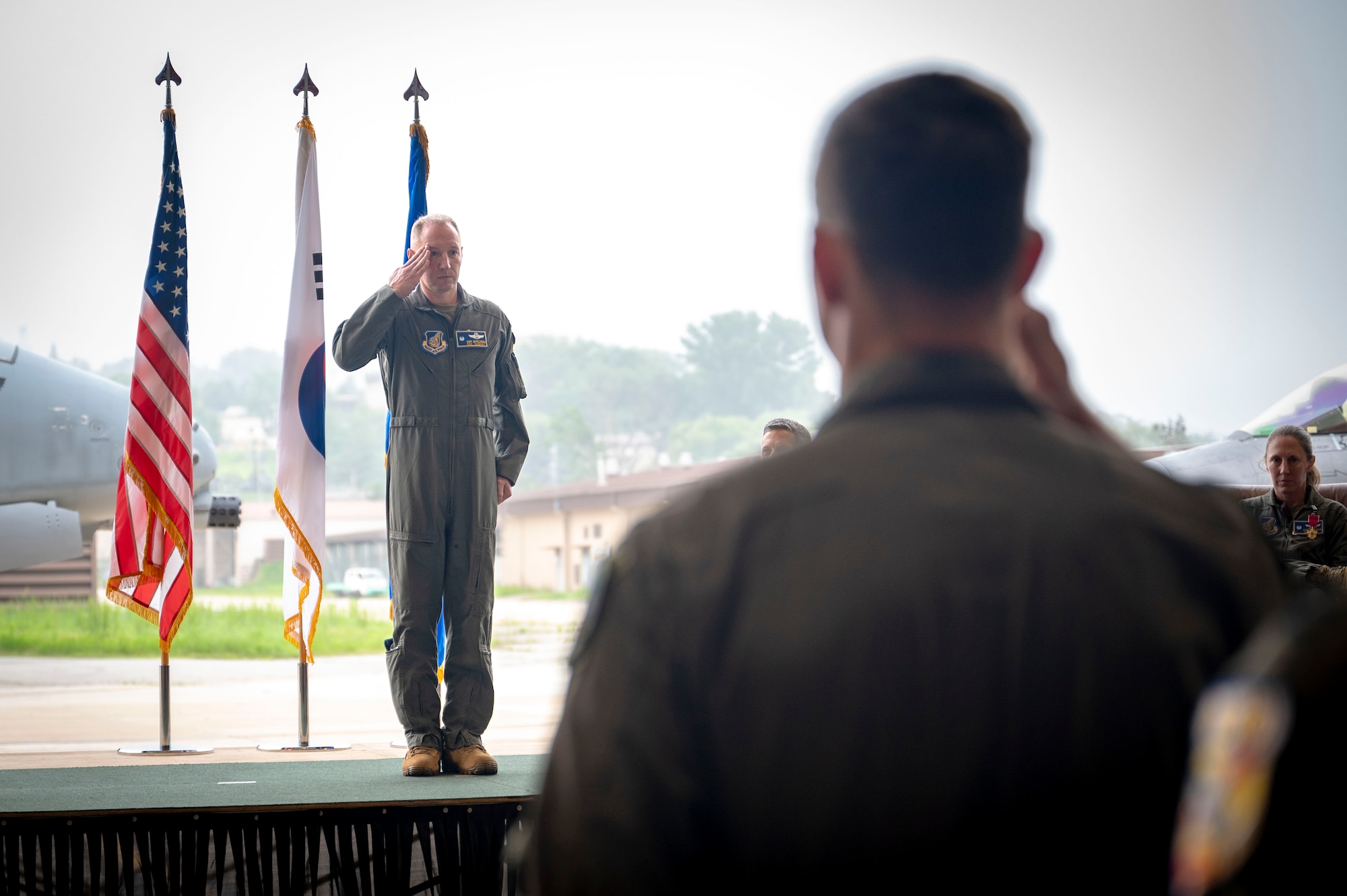 U.S. Air Force Col. Kurt Distelzweig, incoming 51st Operations Group commander, receives his first salute from the 51st OG during a change of command ceremony at Osan Air Base, Republic of Korea, May 22, 2025.