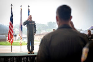 U.S. Air Force Col. Kurt Distelzweig, incoming 51st Operations Group commander, receives his first salute from the 51st OG during a change of command ceremony at Osan Air Base, Republic of Korea, May 22, 2025.