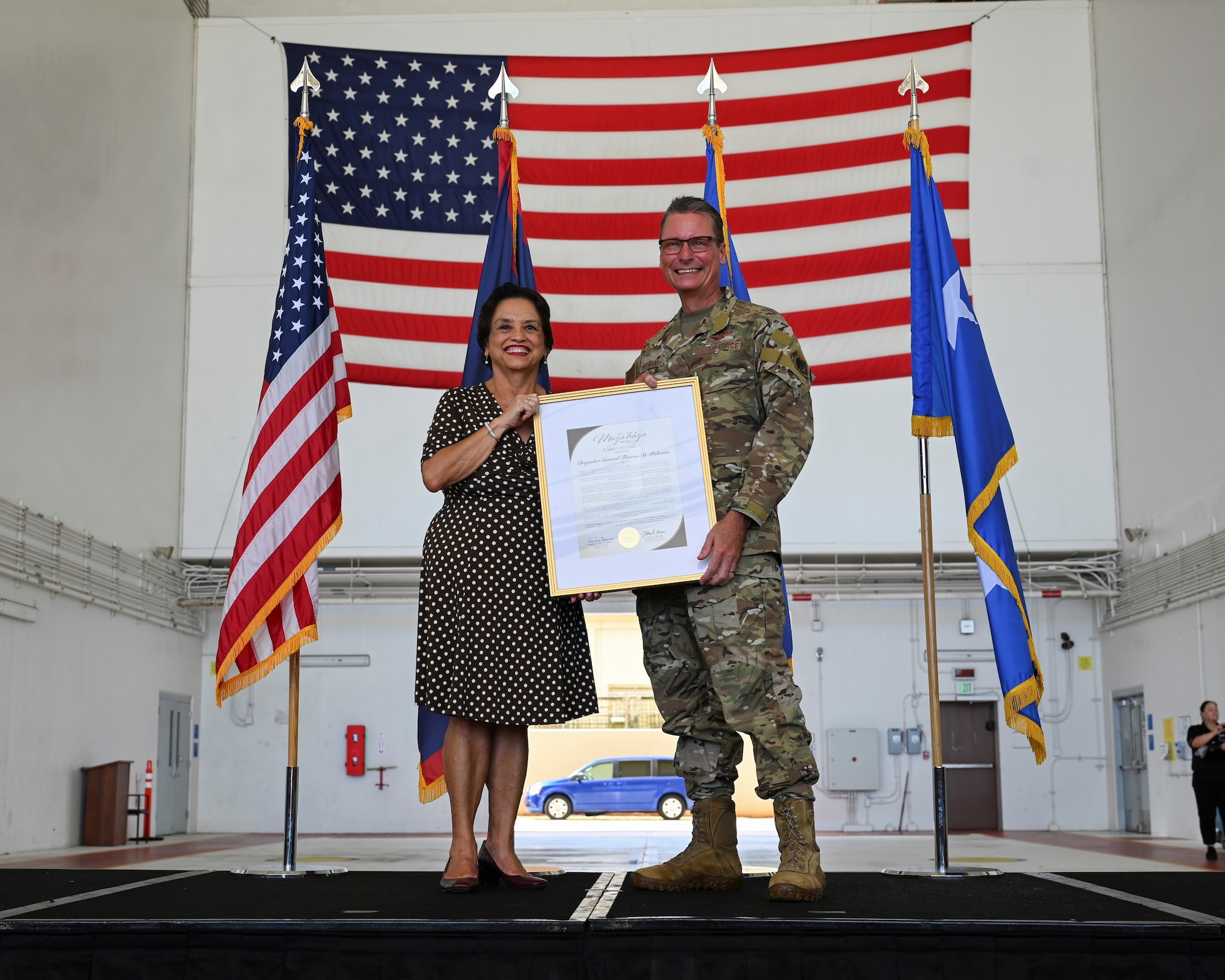 Governor of Guam Lou Leon Guerrero presents the Governor’s Award to U.S. Air Force Brig. Gen. Thomas Palenske, outgoing 36th Wing commander, during the 36th Wing change of command ceremony at Andersen Air Force Base, Guam, May 22, 2025. The governor award was given to Palenske for his humanitarian acts of service, helping Guam and its citizens.
(U.S. Air Force photo by Airman 1st Class Joseph Maye)