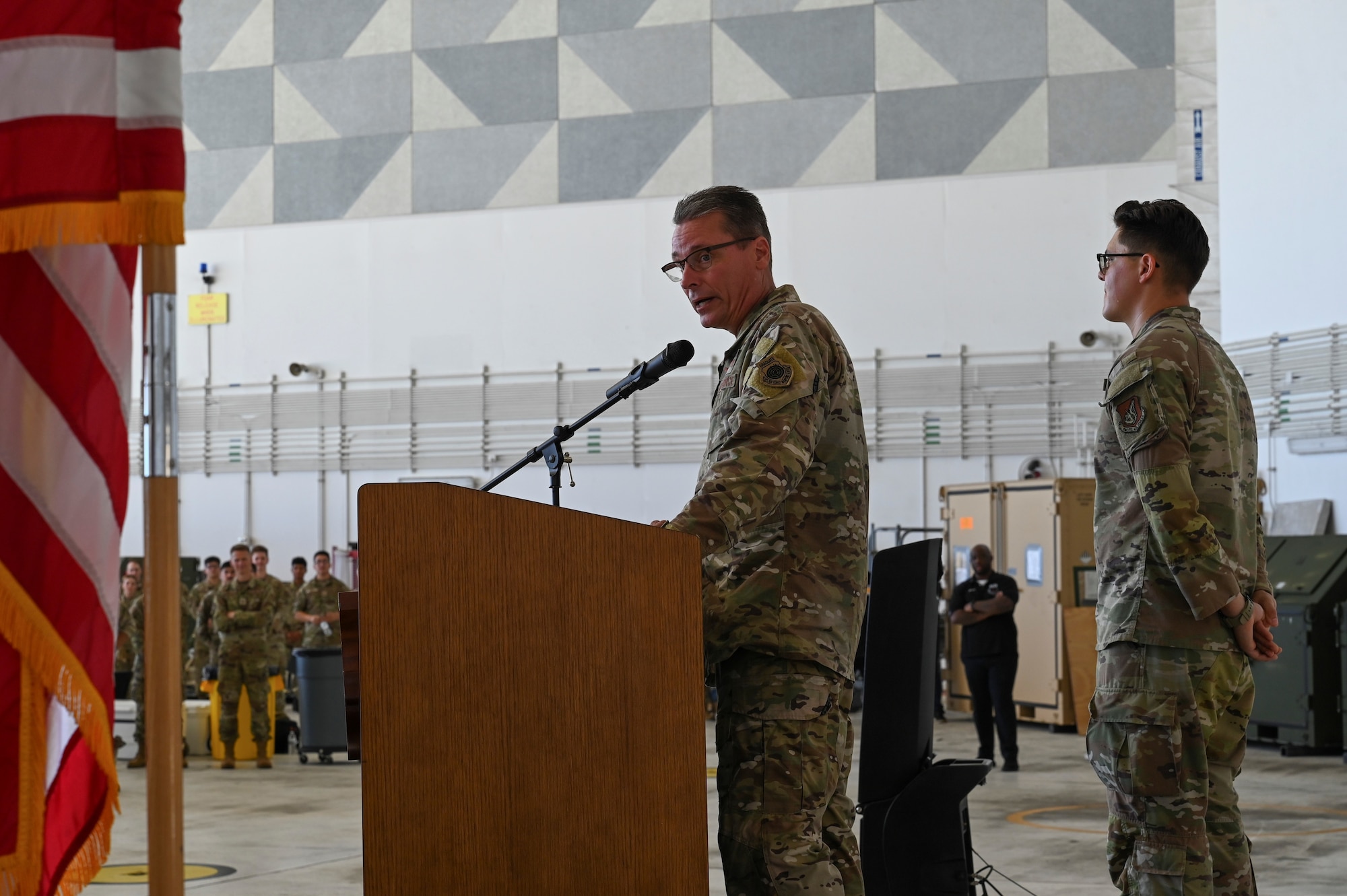 U.S. Air Force Brig. Gen. Thomas Palenske speaks during the 36th Wing change of command ceremony, at Andersen Air Force Base, Guam, May 22, 2025. Palenske thanked the service members who have been at the forefront of defending the Pacific region, while also recognizing the magnitude of what was accomplished by the 36th Wing over the past two years.  (U.S. Air Force photo by Airman 1st Class Joseph Maye)