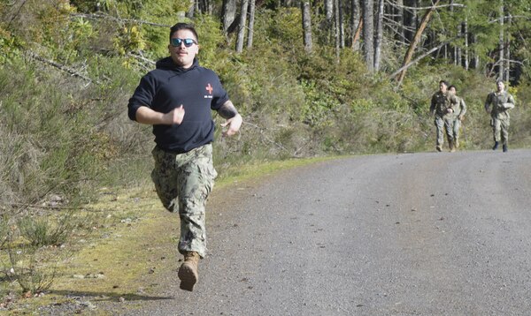 Leading from the FMF front…Hospital Corpsman 1st Class (Fleet Marine Force qualified) Austin Santistevan, Navy Medicine Readiness Training Command Bremerton Tactical Combat Casualty Care course instructor, paces corpsmen students through week-long classroom and field training to hone their abilities in an austere combat environment. “I love being a TCCC instructor. I can teach a course and know I’m making a difference,” said Santistevan, a 13-year Navy veteran, from Pueblo, Colorado and a Centennial High School grad, “home of the Bulldogs.” TCCC is an operational necessity for all corpsmen and is specifically designed to simulate the unique challenges and conditions on the field of battle in handling traumatic injuries (official Navy photo by Douglas H Stutz, NHB/NMRTC Bremerton public affairs officer).