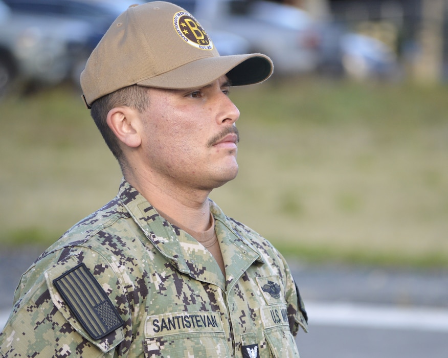 Tactical Combat Casualty Care under Fleet Marine Force supervision… Hospital Corpsman 1st Class (Fleet Marine Force qualified) Austin Santistevan, Navy Medicine Readiness Training Command Bremerton Tactical Combat Casualty Care course instructor keeps an attentive eye on corpsmen students taking week-long TCCC classroom and field training to hone their abilities in an austere combat environment. For Santistevan, teaching the Tactical Combat Casualty Care course is a labor of love. “I love being a TCCC instructor. I can teach a course and know I’m making a difference,” said Santistevan, a 13-year Navy veteran, from Pueblo, Colorado and a Centennial High School grad, “home of the Bulldogs.” (official Navy photo by Douglas H Stutz, NHB/NMRTC Bremerton public affairs officer).