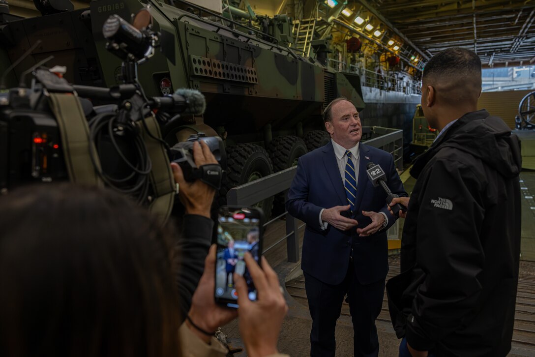 Secretary of the Navy John C. Phelan speaks to a reporter with CBS aboard the San-Antonio Class amphibious transport dock USS New York (LPD 21) in New York, May 21, 2025. America’s warfighting Navy and Marine Corps celebrate 250 years of protecting American prosperity and freedom. Fleet Week New York 2025 honors the Navy, Marine Corps, and Coast Guard’s enduring role on, under, and above the seas. (U.S. Marine Corps photo by Cpl. Christian Salazar)