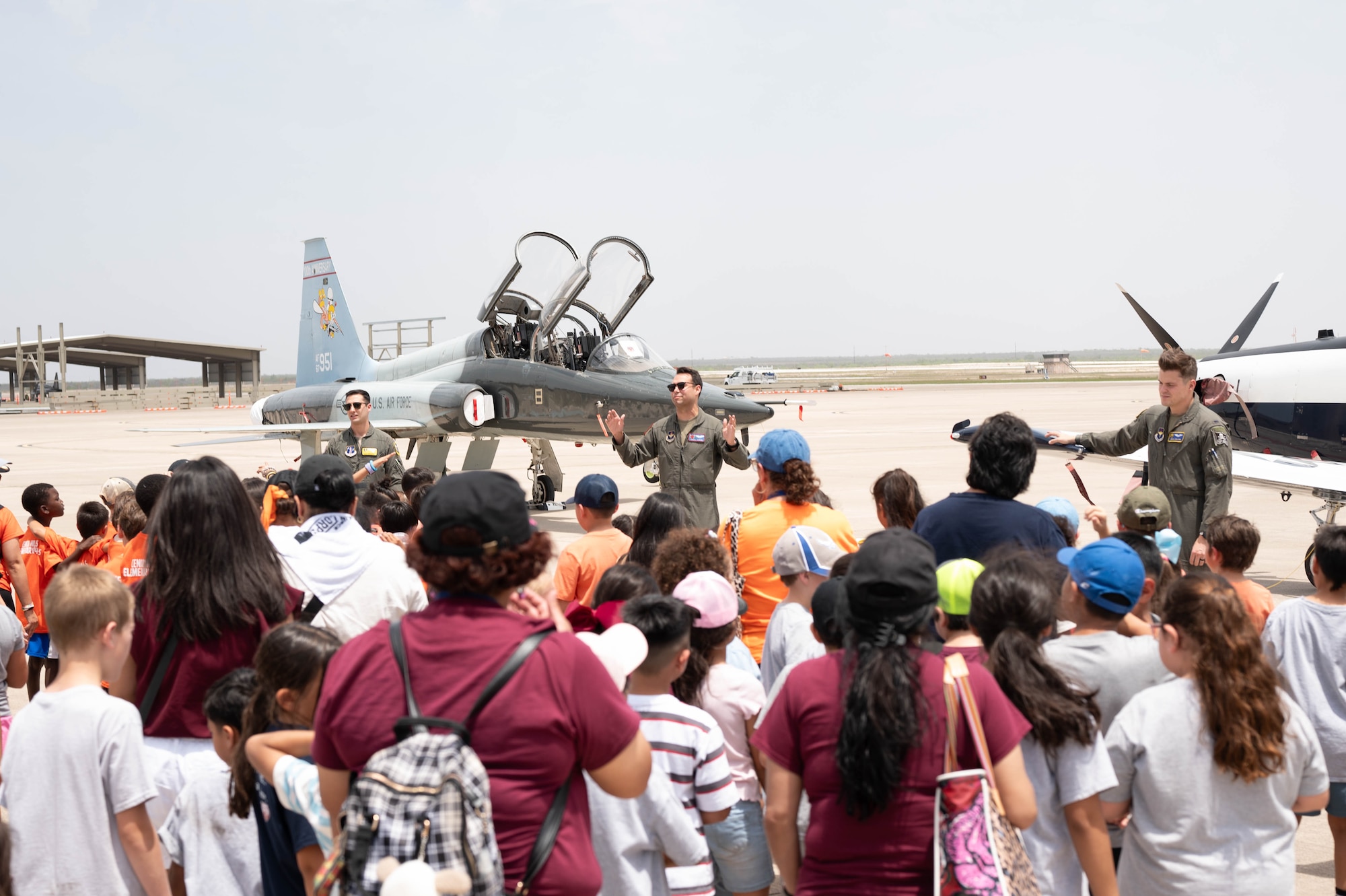 Students tour the flightline during a Ceniza Hills School tour at Laughlin Air Force Base, Texas, May 15, 2025. The visit provided a closer look at the T-6 Texan II and T-38 Talon training aircraft used in pilot production. (U.S. Air Force photo by Senior Airman Keira Rossman)