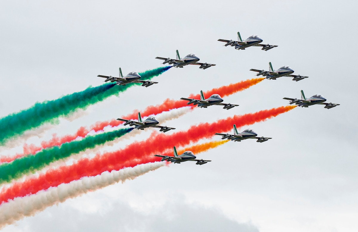 Planes fly displaying colors