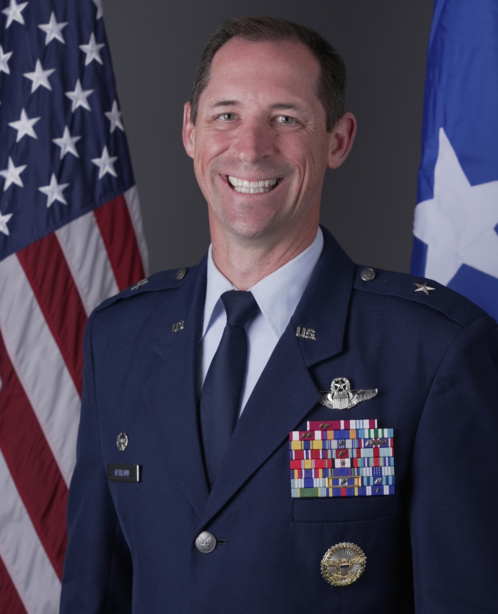 A military member stands for a portrait.