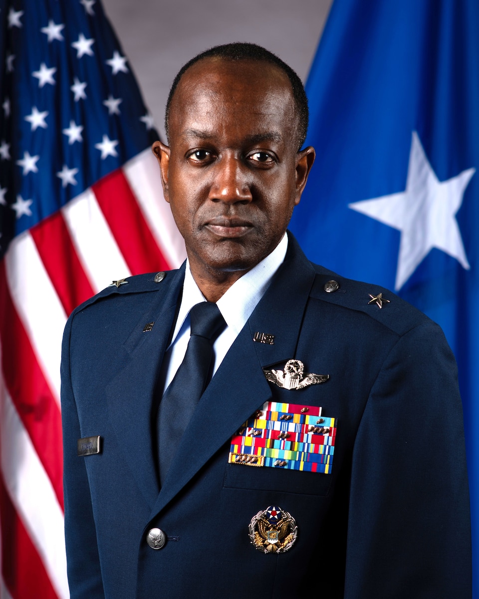 A military member poses for a photo.