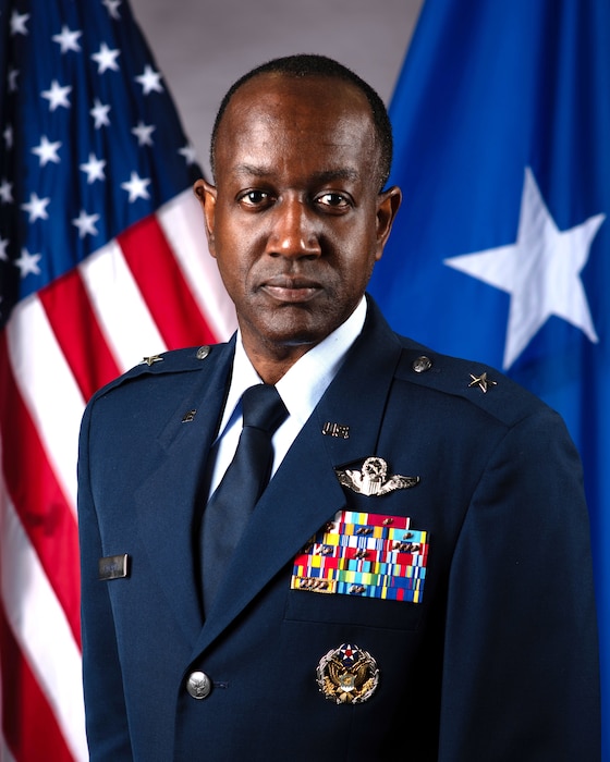 A military member poses for a photo.