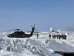 The New Hampshire Army National Guard Medical Readiness Detachment, as part of a joint medical team participating in Operation Arctic Care, load into an Alaska Army National Guard UH-60 Black Hawk helicopter, April 9, 2025, in Shungnak, Alaska. The mission brings together personnel from five military branches and three components to deliver medical, dental, and veterinary care to remote communities in rural Alaska.