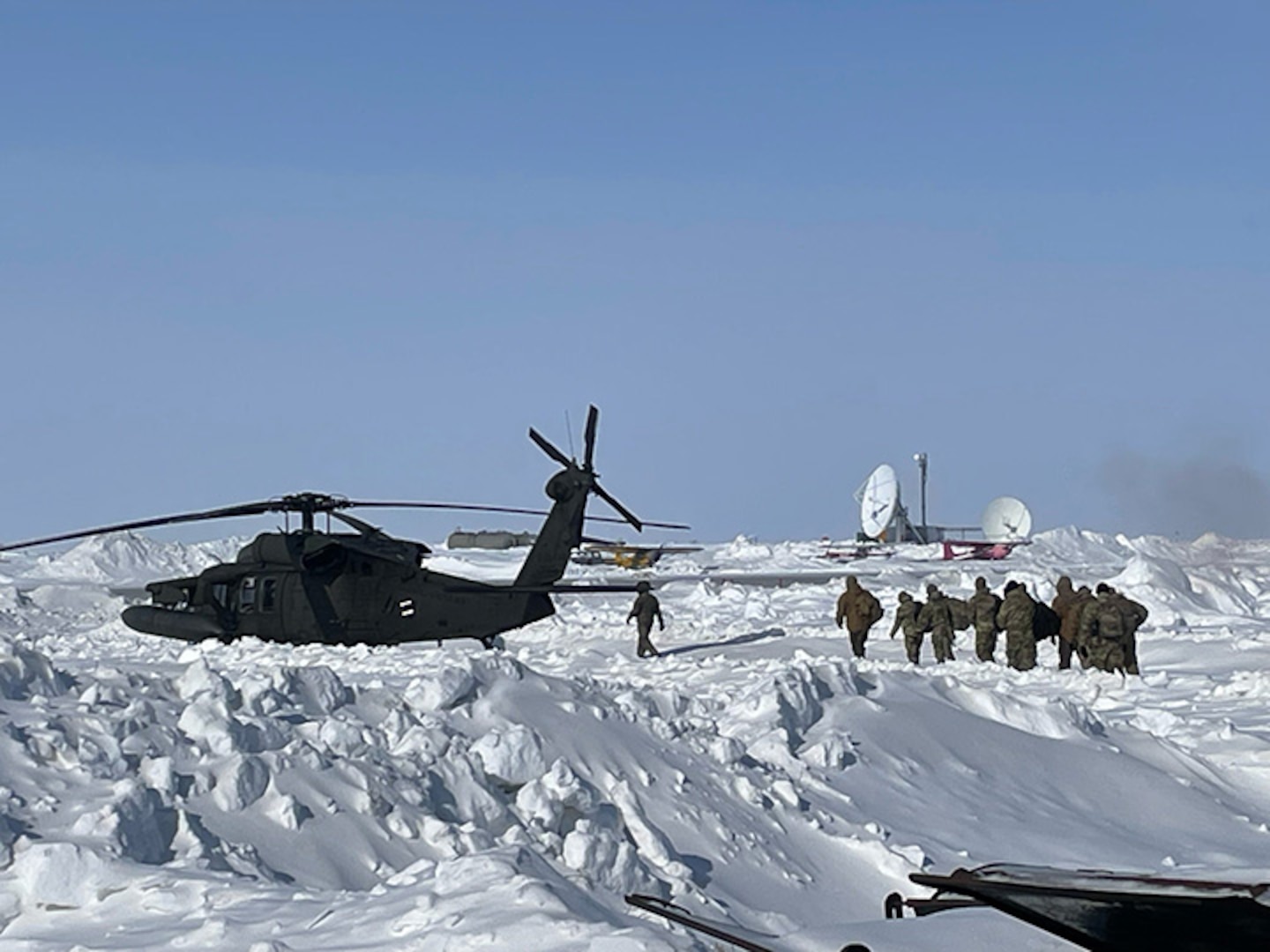 The New Hampshire Army National Guard Medical Readiness Detachment, as part of a joint medical team participating in Operation Arctic Care, load into an Alaska Army National Guard UH-60 Black Hawk helicopter, April 9, 2025, in Shungnak, Alaska.