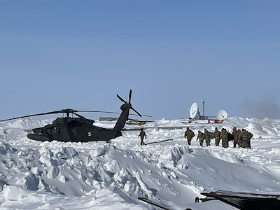 The New Hampshire Army National Guard Medical Readiness Detachment, as part of a joint medical team participating in Operation Arctic Care, load into an Alaska Army National Guard UH-60 Black Hawk helicopter, April 9, 2025, in Shungnak, Alaska.