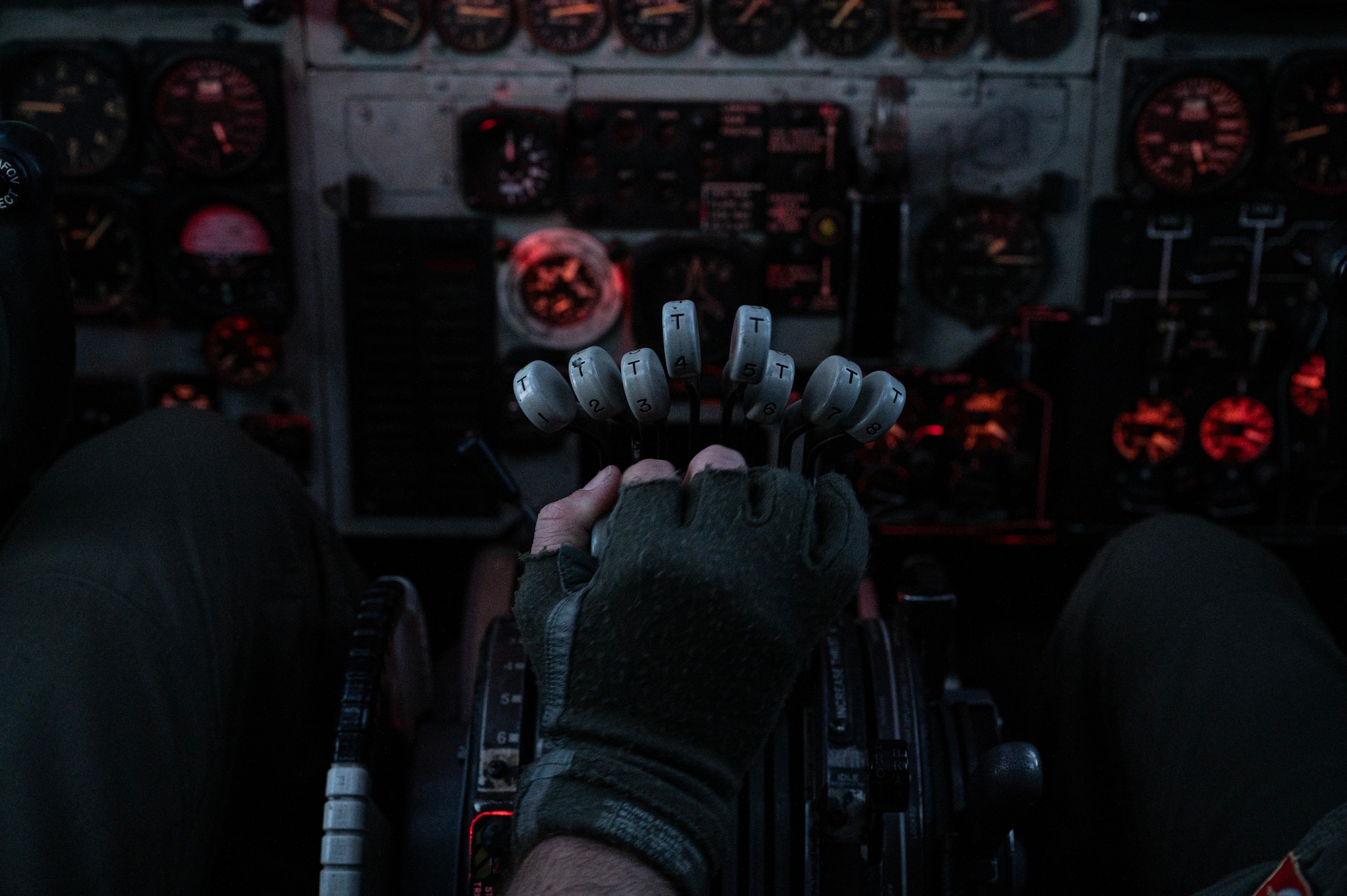 A U.S. Air Force B-52 Stratofortress aircraft pilot assigned to the 23rd Expeditionary Bomb Squadron adjusts the throttles of a B-52 during the current Bomber Task Force deployment over the North Atlantic Ocean, May 19, 2025. BTF missions align with U.S. Strategic Command regularly tests and evaluates the readiness of strategic assets to ensure our extended deterrence commitments are strong and credible. (U.S. Air Force photo by Staff Sgt. Bryan Guthrie)