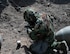 Airman 1st Class Robert Hobbs, 5th Civil Engineer Squadron Explosive Ordnance Disposal apprentice, sets up an improvised shape charge while in Mission Oriented Protective Posture level 4 at Minot Air Force Base, North Dakota, May 12, 2025. The event aimed to train new Airmen for the EOD flight in detonating shape charges and observe their effects. The EOD flight is tasked with  neutralizing hazards associated with explosive ordnance that pose a threat to people, installations, and operations. (U.S. Air Force photo by Airman 1st Class Wesley Davies)