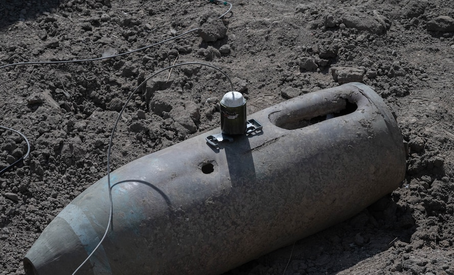 An improvised shape charge setup on an inert munition training material for a training event at Minot Air Force Base, North Dakota, May 12, 2025. An improvised shape charge is used during training to help Airmen distinguish what impact the material used can have on an explosive. The EOD flight is tasked with  neutralizing hazards associated with explosive ordnance that pose a threat to people, installations, and operations.  (U.S. Air Force photo by Airman 1st Class Wesley Davies)