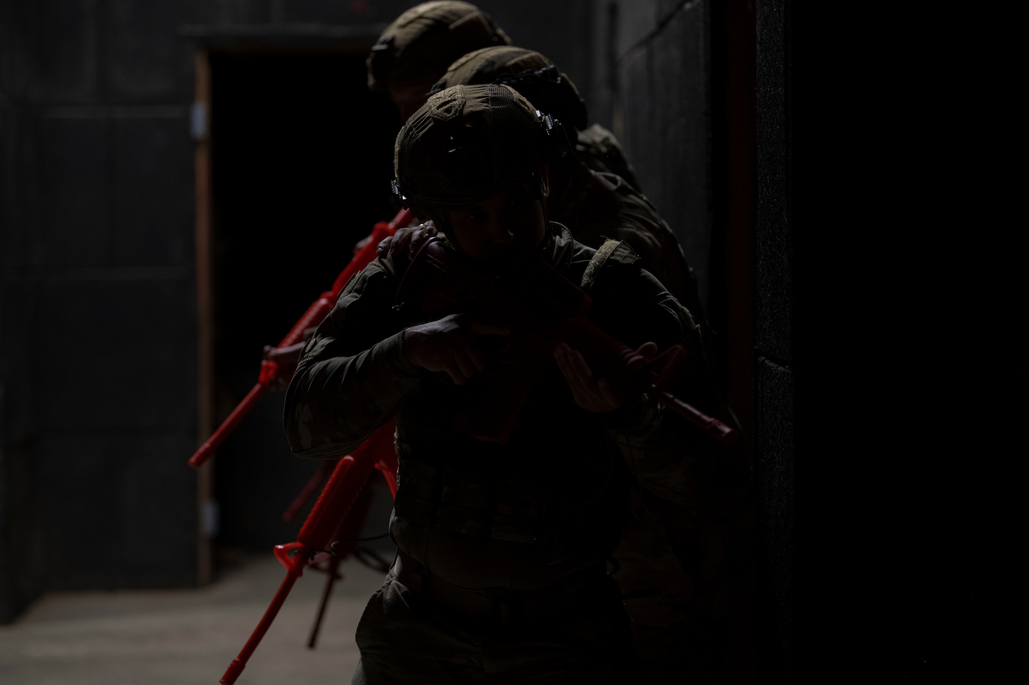 U.S. Airmen with the Air National Guard prepare to clear a room during the 2025 Virgin Islands and Puerto Rico emergency management Deployment for Training at Camp Santiago Joint Training Center, Salinas, Puerto Rico, May 15, 2025. The 2025 VIPR EM DFT measured multiple ANG civil engineer squadrons’ mission readiness by simulating an austere location to prepare participating Airmen to execute the Agile Combat Employment Concept within the U.S. Air Force Indo-Pacific Command area of responsibility. (U.S. Air National Guard photo by Senior Airman Victoria A. Jewett)