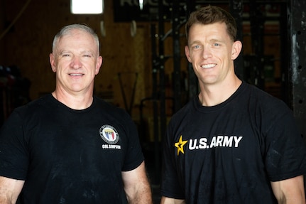 U.S. Army Col. Eddie Simpson (left) and 1st Lt. Erik Thomas pose for a post-workout photo at CrossFit Frankfort in Frankfort, Ky. on May 15, 2025. Simpson and Thomas, both members of the Kentucky Army National Guard, qualified for the 2025 CrossFit Games.