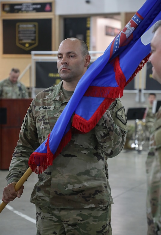 U.S. Army Lt. Col. Stephen Strack, incoming battalion commander, holds the unit guidon after it was passed to him signifying the exchange of command during the Recruiting and Retention Battalion’s change of command ceremony at Wellman Armory on Boone National Guard Center in Frankfort May 20, 2025.