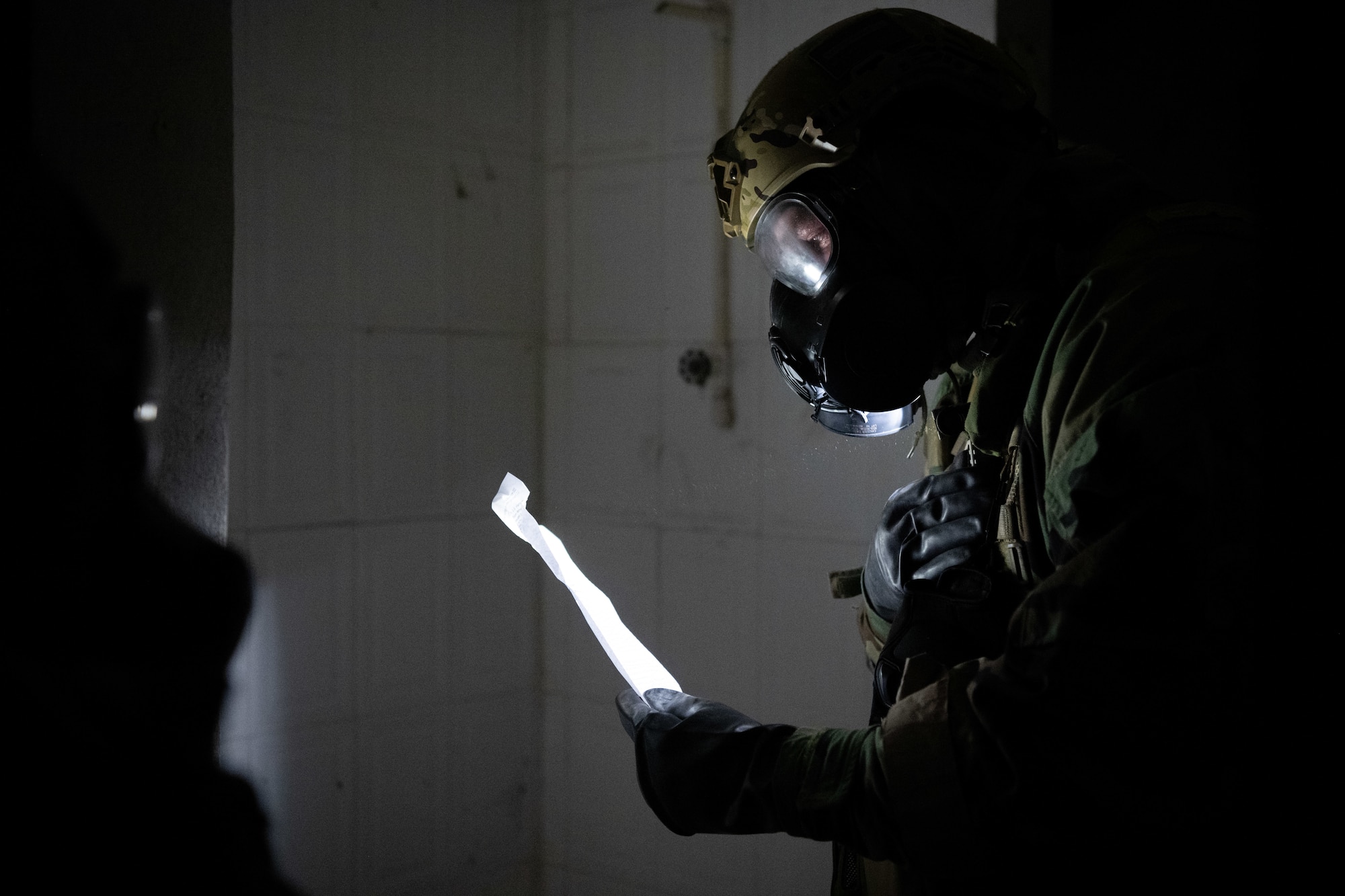 U.S. Air Force Staff Sgt. Robert Gabrielini, an emergency management specialist with the 105th Civil Engineer Squadron, New York Air National Guard, discovers a plan sheet inside a building during the 2025 Virgin Islands and Puerto Rico emergency management Deployment for Training at Fort Allen, Juana Diaz, Puerto Rico, May 18, 2025. The 2025 VIPR EM DFT measured multiple ANG civil engineer squadrons’ mission readiness by simulating an austere location to prepare participating Airmen to execute the Agile Combat Employment Concept within the U.S. Air Force Indo-Pacific Command area of responsibility. (U.S. Air National Guard photo by 1st Lt. Eliezer Soto)