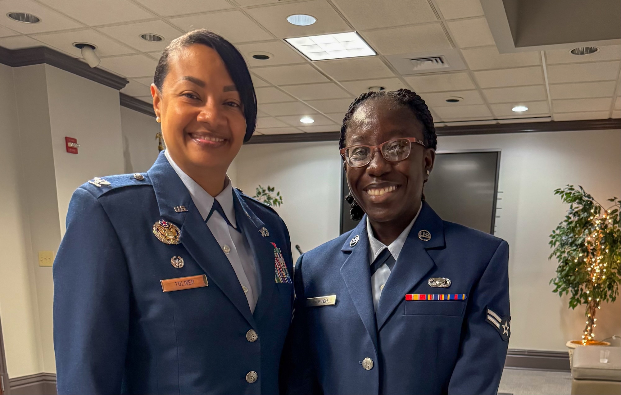 U.S. Air Force Col. Shamekia Toliver, left, 42d Air Base Wing commander, and Airman 1st Class Angel Akueteh, 42nd Force Support Squadron customer support technician, pose for a photo at Troy University, May 21, 2025.