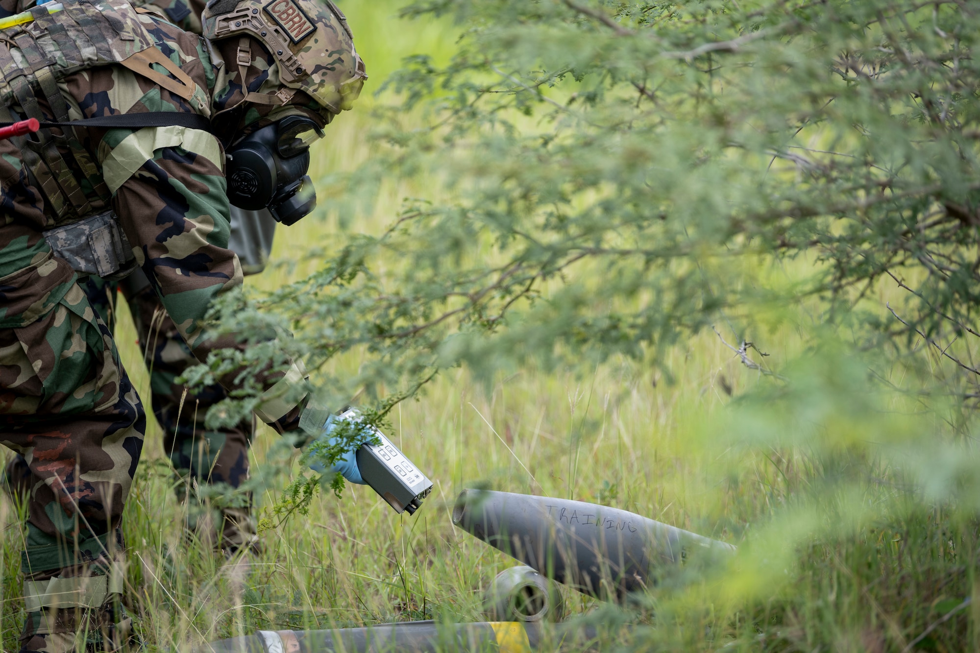 U.S. Airman with the Air National Guard, examines a chemical explosive substance during the 2025 Virgin Islands and Puerto Rico emergency management Deployment for Training at Camp Santiago Joint Training Center, Salinas, Puerto Rico, May 19, 2025. The 2025 VIPR EM DFT measured multiple ANG civil engineer squadrons’ mission readiness by simulating an austere location to prepare participating Airmen to execute the Agile Combat Employment Concept within the U.S. Air Force Indo-Pacific Command area of responsibility. (U.S. Air National Guard photo by Senior Airman Victoria A. Jewett)