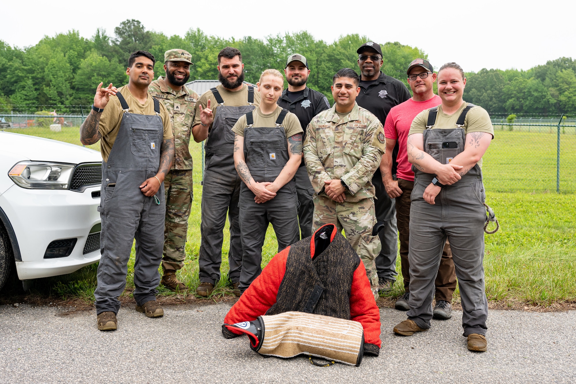 Members of the 436th Security Forces Squadron military working dog team and Worcester County Sheriff’s Office Maryland, pose for a photo at Dover Air Force Base, Delaware, May 14, 2025.