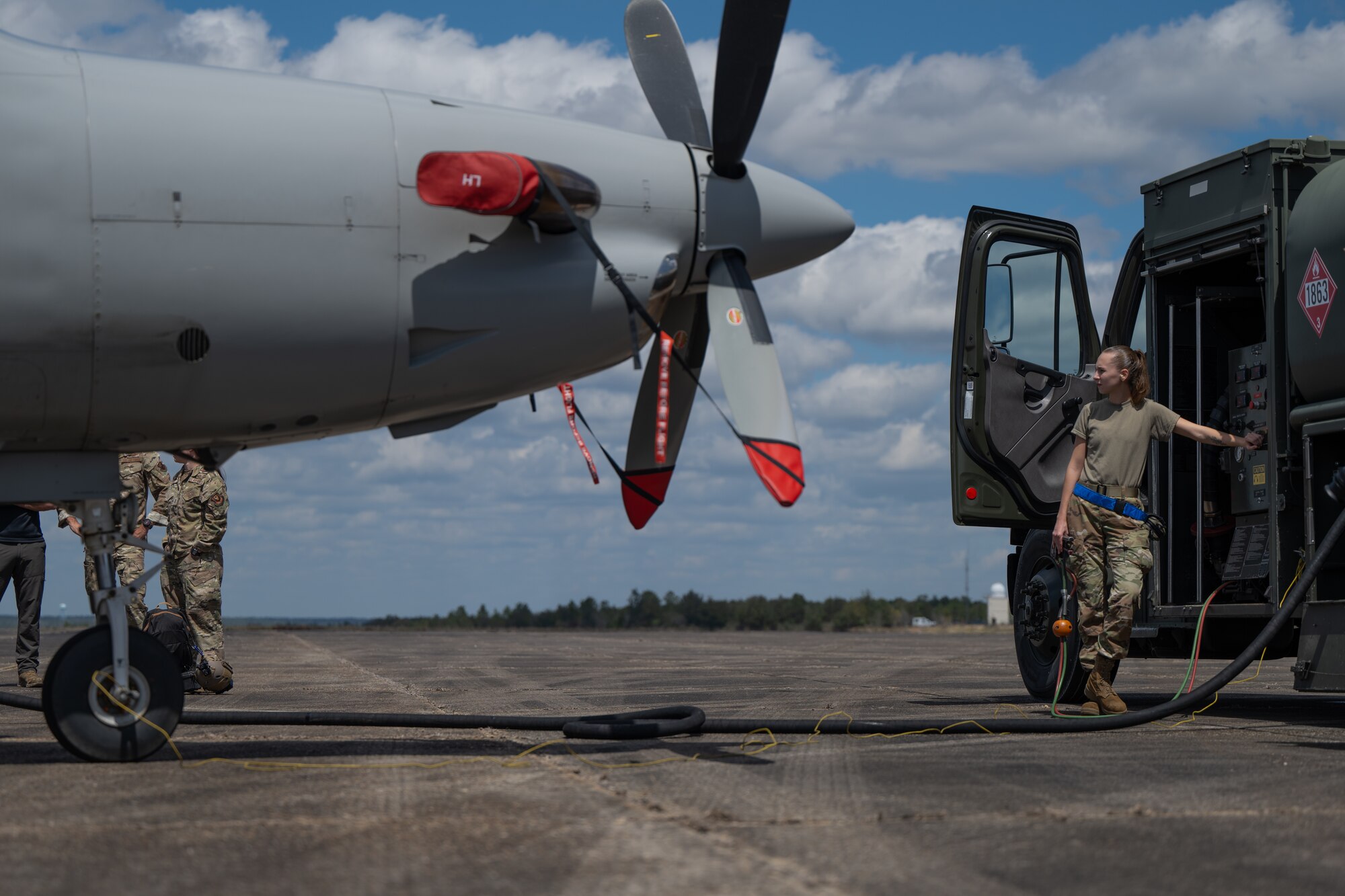 U.S. Air Force Airman 1st Class Kendal Gillen, assigned to the 96th Logistic Readiness Squadron assists in refueling a U-28A Draco during a joint unit base exercise near Hurlburt Field, Florida, March 25, 2025.