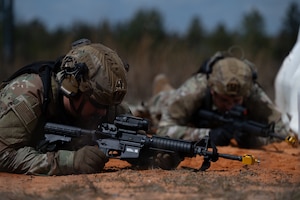U.S. Airmen assigned to the 1st Special Operations Wing take cover after a simulated explosion during a joint unit base exercise near Hurlburt Field, Florida, March 25, 2025.