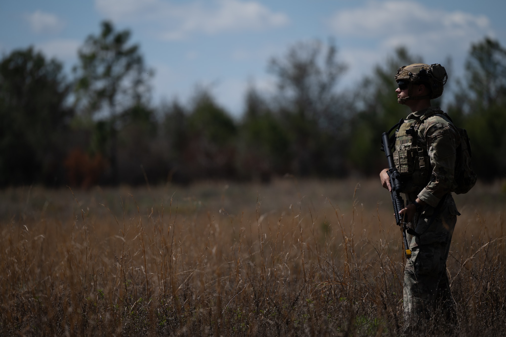 A U.S. Airman assigned to the 1st Special Operations Wing patrols an area during a joint unit base exercise near Hurlburt Field, Florida, March 25, 2025.