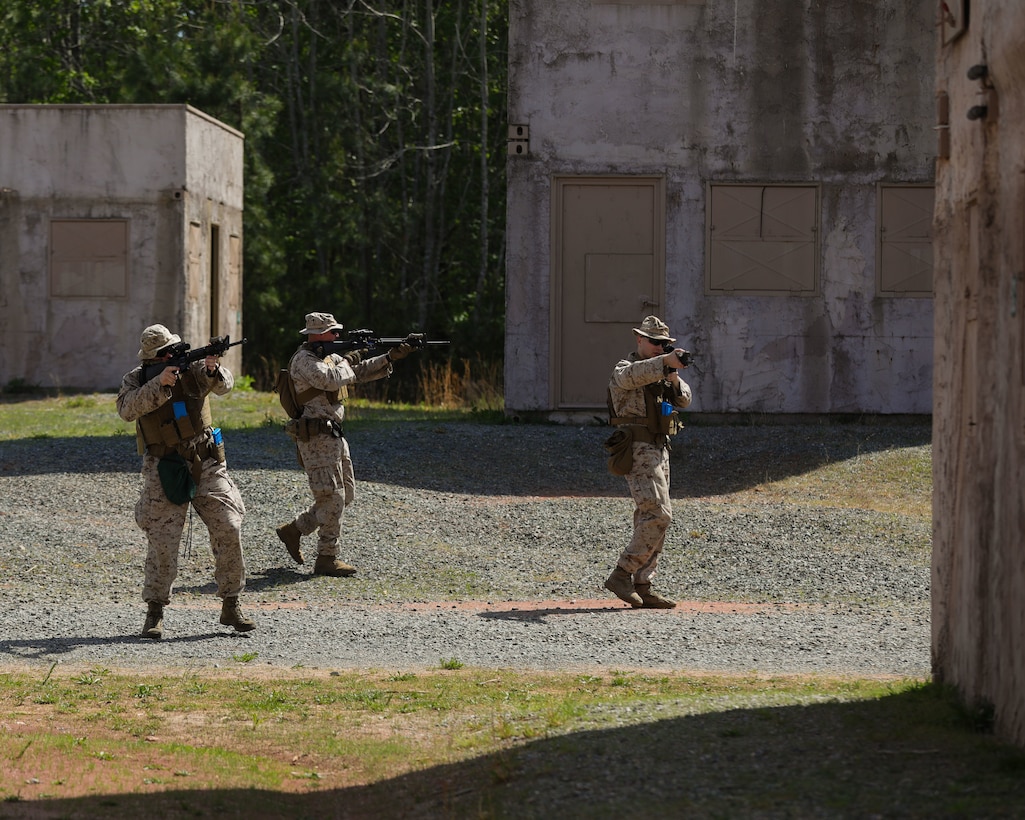 U.S. Marines with Alpha Company, Marine Barracks Washington, move hastily between structures while conducting Military Operations on Urbanized Terrain training at Marine Corps Base Quantico, Virginia, April 29, 2025. This comprehensive training provided the Marines with the opportunity to refine their urban warfare tactics in a dynamic, real-world setting. Emphasizing speed, precision, and tactical coordination, the Marines worked through a series of challenging exercises, including room clearing, security maneuvers, and small unit tactics. The training simulated complex urban environments, testing their ability to adapt and respond to threats while maintaining control of the area. Throughout the training, the company honed their combat skills and strengthened unit cohesion, fostering a deeper sense of trust and teamwork. By navigating through realistic, scenario-driven challenges, the Marines fine-tuned their communication and decision-making abilities, essential elements in any combat situation. 8th & I Marines conduct routine field training to remain capable of facing the demands of modern warfare with confidence and expertise.